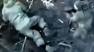 A UA soldier with drone support in close combat with a pair of Orcs