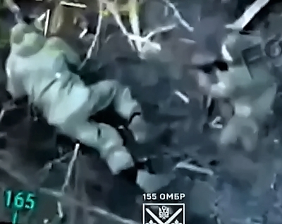 A UA soldier with drone support in close combat with a pair of Orcs