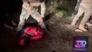 Horrific Video Shows CJNG Cartel Members Hacking Two Rivals Alive with Axes & Machete