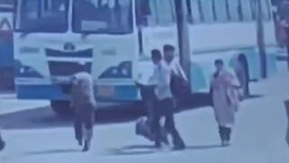 Man Throws Himself Under Moving Bus On The Busy Road In India
