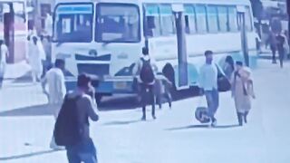 Man Throws Himself Under Moving Bus On The Busy Road In India