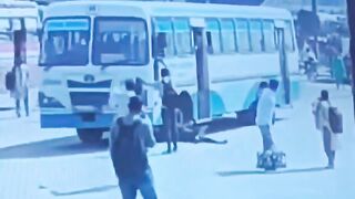 Man Throws Himself Under Moving Bus On The Busy Road In India