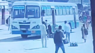 Man Throws Himself Under Moving Bus On The Busy Road In India
