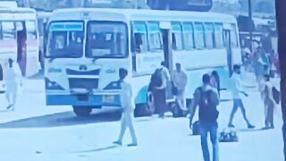 Man Throws Himself Under Moving Bus On The Busy Road In India