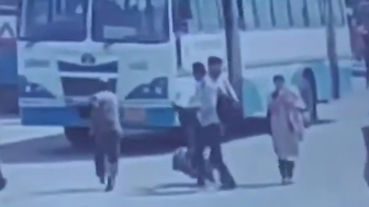 Man Throws Himself Under Moving Bus On The Busy Road In India
