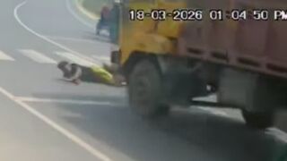 Motorcyclist Run Over And Trapped By The Truck Wheel