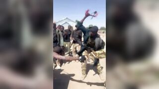 Nigerian Soldiers Having Fun With Killed Boko Haram Terrorist