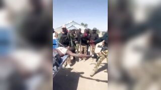 Nigerian Soldiers Having Fun With Killed Boko Haram Terrorist