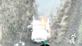 A russian invader got stuck in a burning vehicle