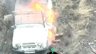 A russian invader got stuck in a burning vehicle