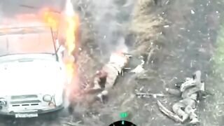 A russian invader got stuck in a burning vehicle