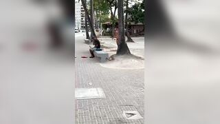 Naked Woman in Brazil throws Stones at Man on the Bench