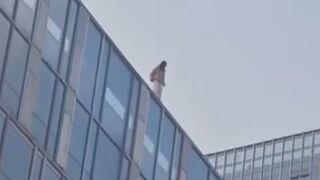 Woman Jumps From A Tall Building