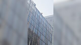 Woman Jumps From A Tall Building