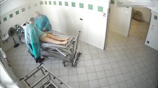 Preparing dead woman body in the funeral home