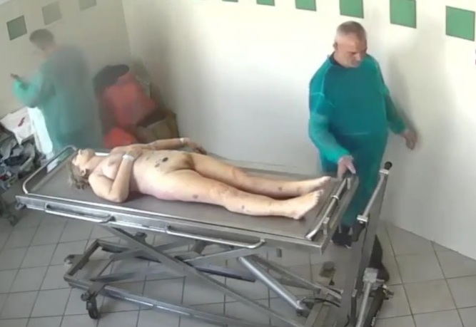 Preparing dead woman body in the funeral home