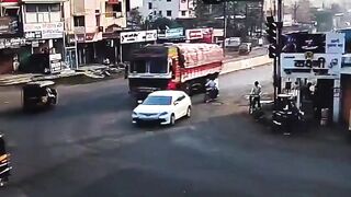 Two On A Motorcycle Fall Under The Truck Wheels, Die On Spot