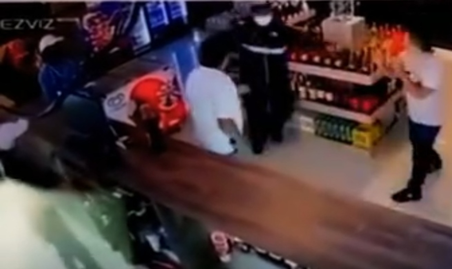 3 Masked Assassins Storm Liquor Store and Execute Shoppers at Point-Blank Range
