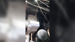 Woman Jumps From The Roof Of Burning Building In India