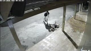 Drunk Man Lying On The Street Randomly Attacked With A Rock