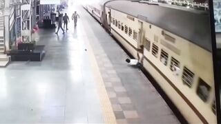 Man Leaps Onto Moving Train, Falls and Gets Dragged Spinning For Meters