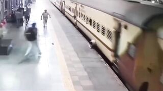 Man Leaps Onto Moving Train, Falls and Gets Dragged Spinning For Meters