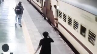 Man Leaps Onto Moving Train, Falls and Gets Dragged Spinning For Meters