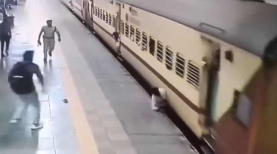 Man Leaps Onto Moving Train, Falls and Gets Dragged Spinning For Meters
