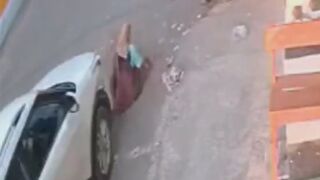 Woman Sweeping The Road Gets Run Over