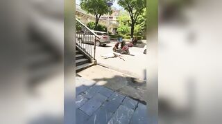 Woman Riding A Moped Falls Head First Under The Bus Wheel