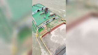 A ferry collides with a cargo  barge