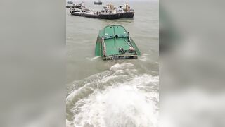 A ferry collides with a cargo  barge