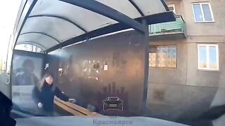 Car hits woman at bus stop