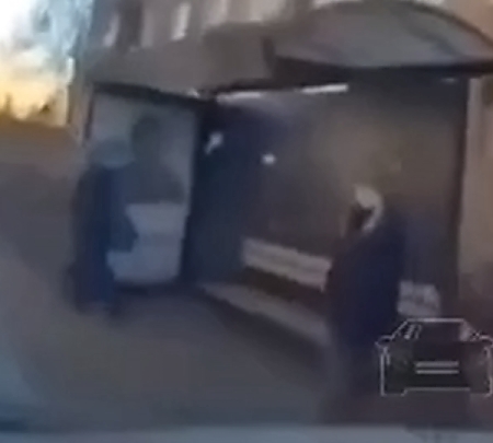 Car hits woman at bus stop