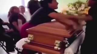LoL "Widow argues with her husband's mistress at his coffin"