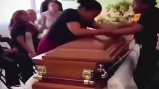LoL "Widow argues with her husband's mistress at his coffin"