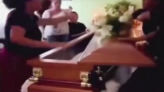 LoL "Widow argues with her husband's mistress at his coffin"