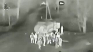 Ukrainian kamikaze drone flies into a crowd of Russian soldiers.