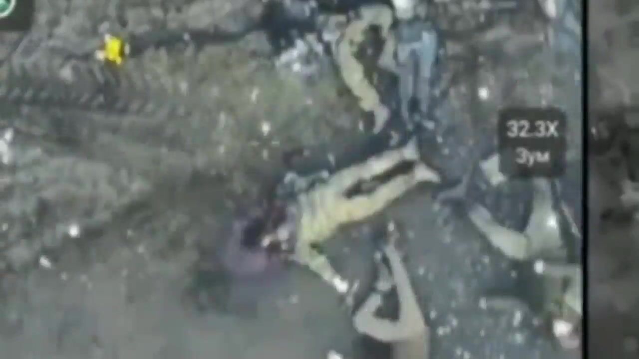 Ukrainian kamikaze drone flies into a crowd of Russian soldiers.