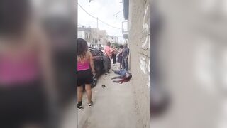 Gunmen Descend from Car and Execute Two Rivals in Brutal Shooting