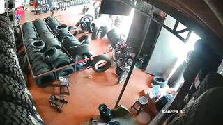 Auto Parts Store Nightmare:Giant Shelf Loaded with Tires Crashes Down on Female Worke