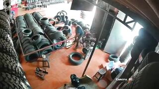 Auto Parts Store Nightmare:Giant Shelf Loaded with Tires Crashes Down on Female Worke