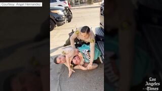 Los Angeles police officer abusing arrested man