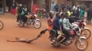 Captured Thief Brutally Killed & Dragged Through the Streets by Angry Mob on Motorcycle