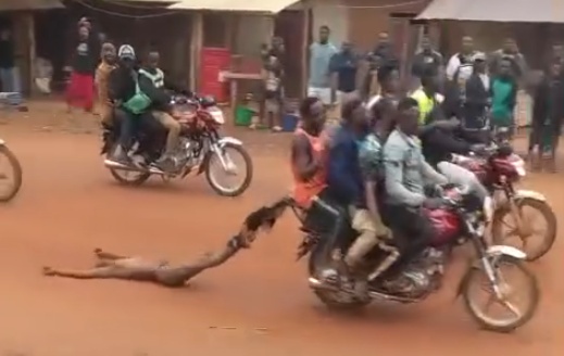 Captured Thief Brutally Killed & Dragged Through the Streets by Angry Mob on Motorcycle