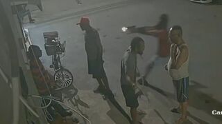 Hooded Hitman Ambush: Multiple Shots End Conversation on the Sidewalk