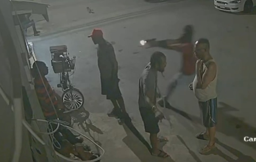 Hooded Hitman Ambush: Multiple Shots End Conversation on the Sidewalk