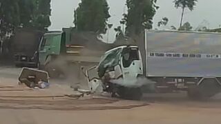 Driver Ejected After Collision Between Two Trucks In Vietnam