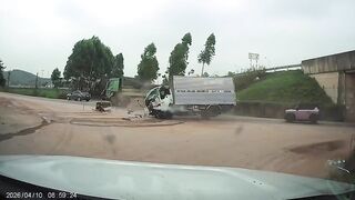 Driver Ejected After Collision Between Two Trucks In Vietnam