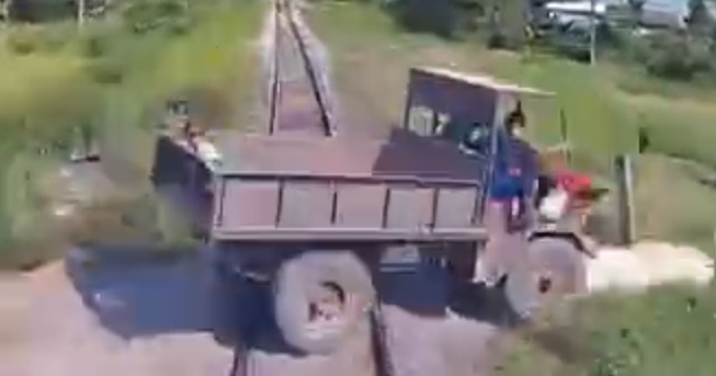 Insane Moment: Train Destroys Truck and Ejects Passenger Like a Rocket